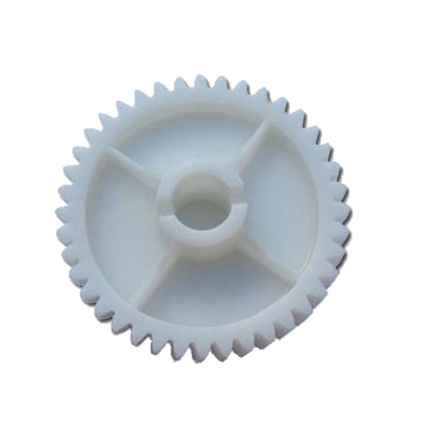 White plastic gear replacement part for smart garage door opener servicing by SAMT in Australia.