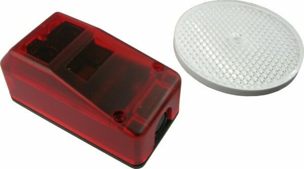 Red reflective sensor for automatic garage door opener at SAMT Garage & Gate Automation, Prestons, New South Wales, Australia.