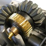 Close-up of brass and steel gears inside an automated gate motor mechanism in Prestons, New South Wales, Australia