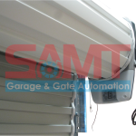 Close-up of SAMT roller door motor installation, automatic garage door system, Prestons, Australia.