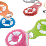 Variety of Key Automation wireless remotes in orange, red, blue, pink, green, and gray, with company logo, shown in Prestons, New South Wales, Australia.