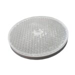 Round reflective safety marker, close-up, on white background in Prestons, New South Wales, Australia.